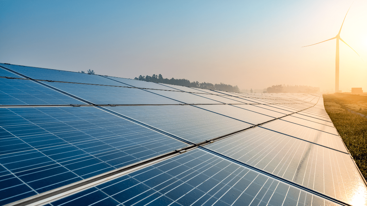 Aerial view of a utility-scale solar project under construction in a semi-arid region.