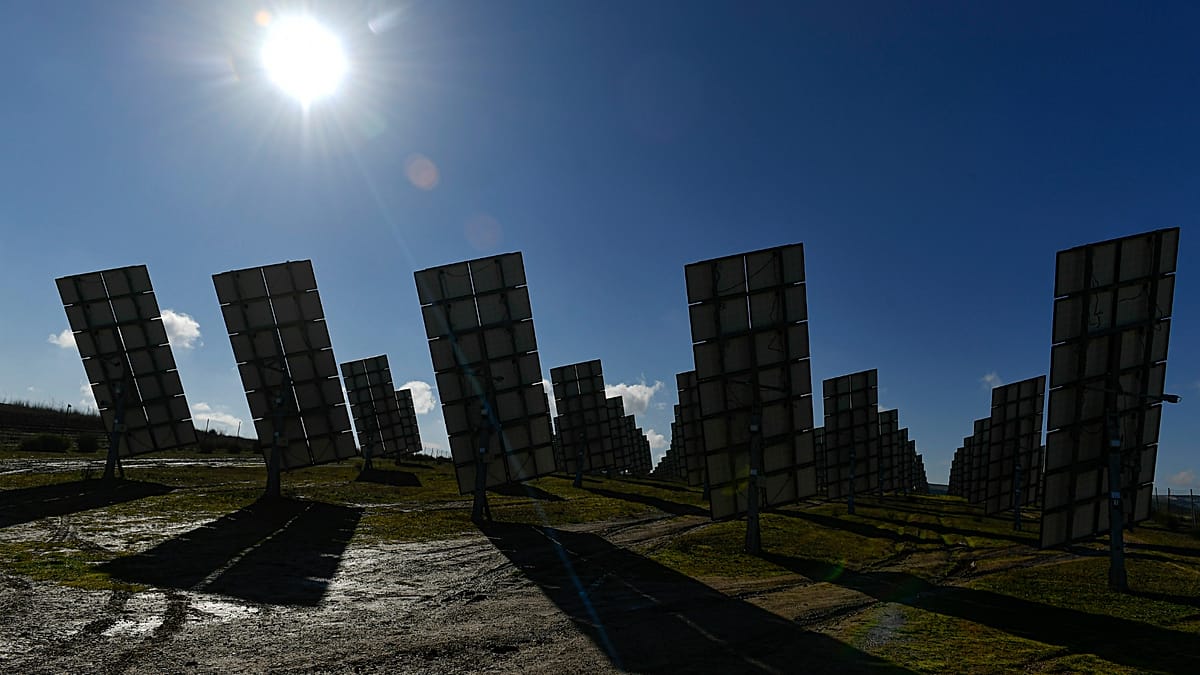 Aerial view of a massive utility-scale solar farm in the Spanish countryside near Badajoz.
