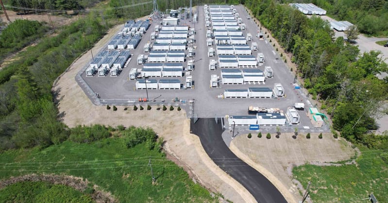 Large-scale lithium-ion battery containers installed at a grid-connected utility site in Maine.