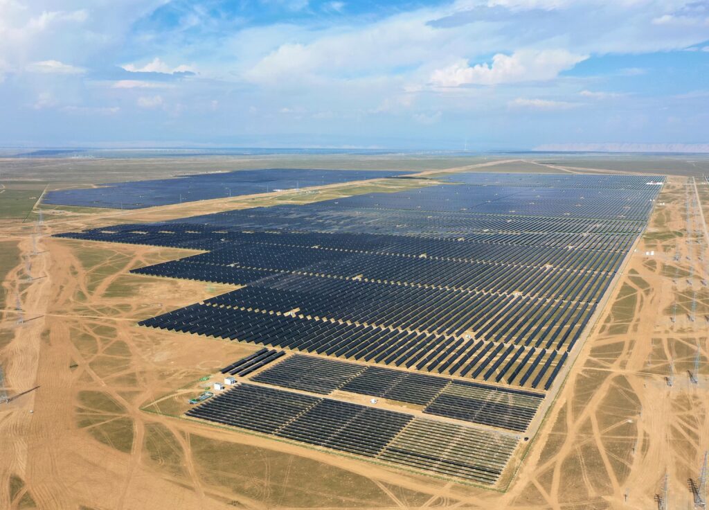 Aerial view of a large-scale solar PV plant located in a dry desert landscape