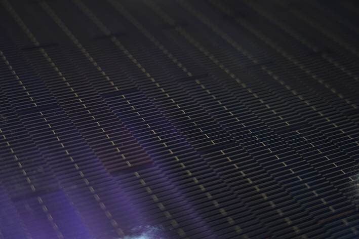 A close-up of a perovskite-silicon tandem solar module with shingled cell interconnection technology.