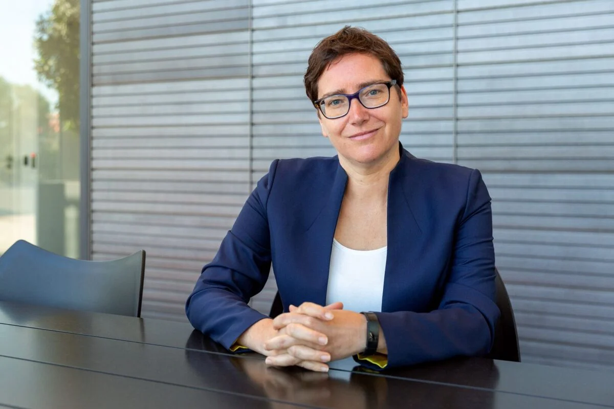 Wärtsilä energy storage system installation with modern solar panels in a European industrial park setting.