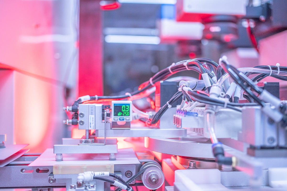 Close up of a Jinko solar panel on a commercial rooftop installation site