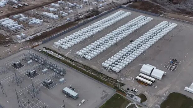Large scale battery energy storage system containers installed at a utility site under bright sunlight