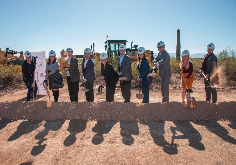 Industrial battery storage units lined up in a modern warehouse facility for distribution