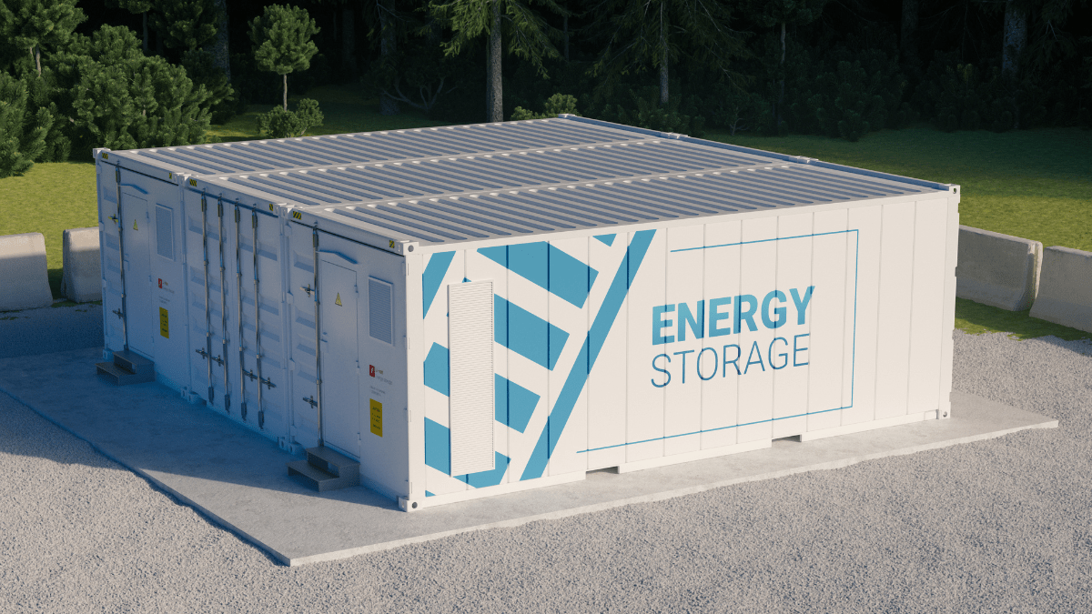 Industrial microgrid setup with solar panels and containerized battery storage system near a factory.
