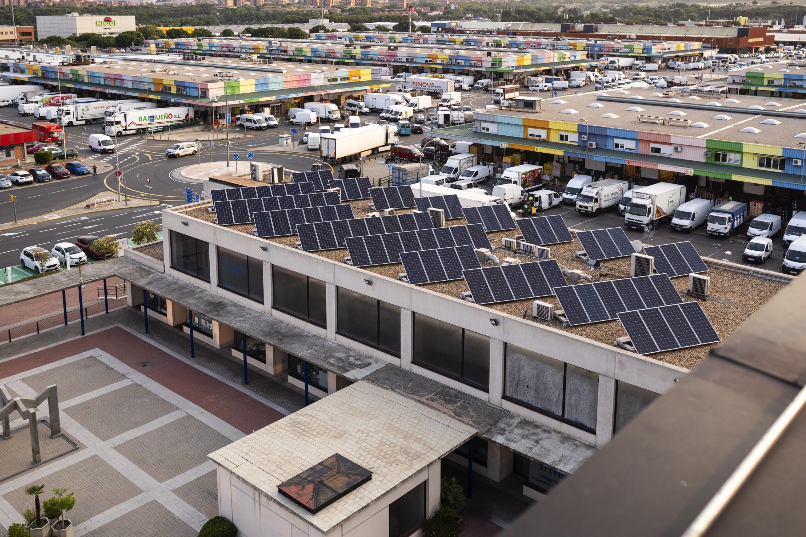 Aerial view of solar panels on a large industrial roof in Madrid, Spain