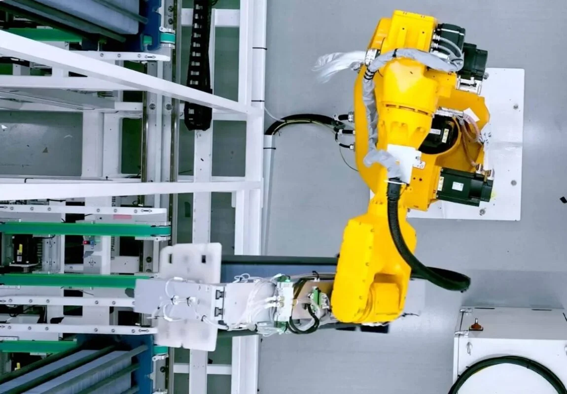 Automated solar cell production line with robotic arms in a high-tech manufacturing facility