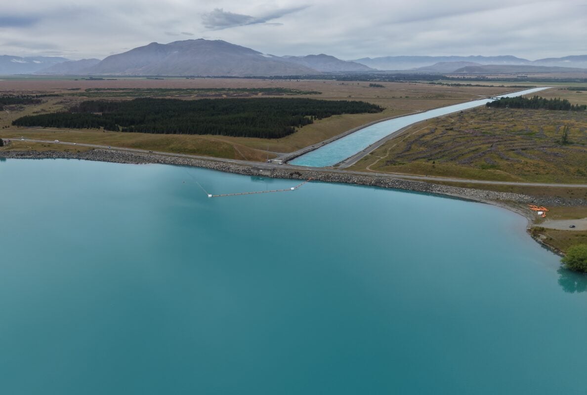 Aerial view of Lake Pūkaki’s turquoise waters, a massive natural energy storage reservoir in New Zealand.