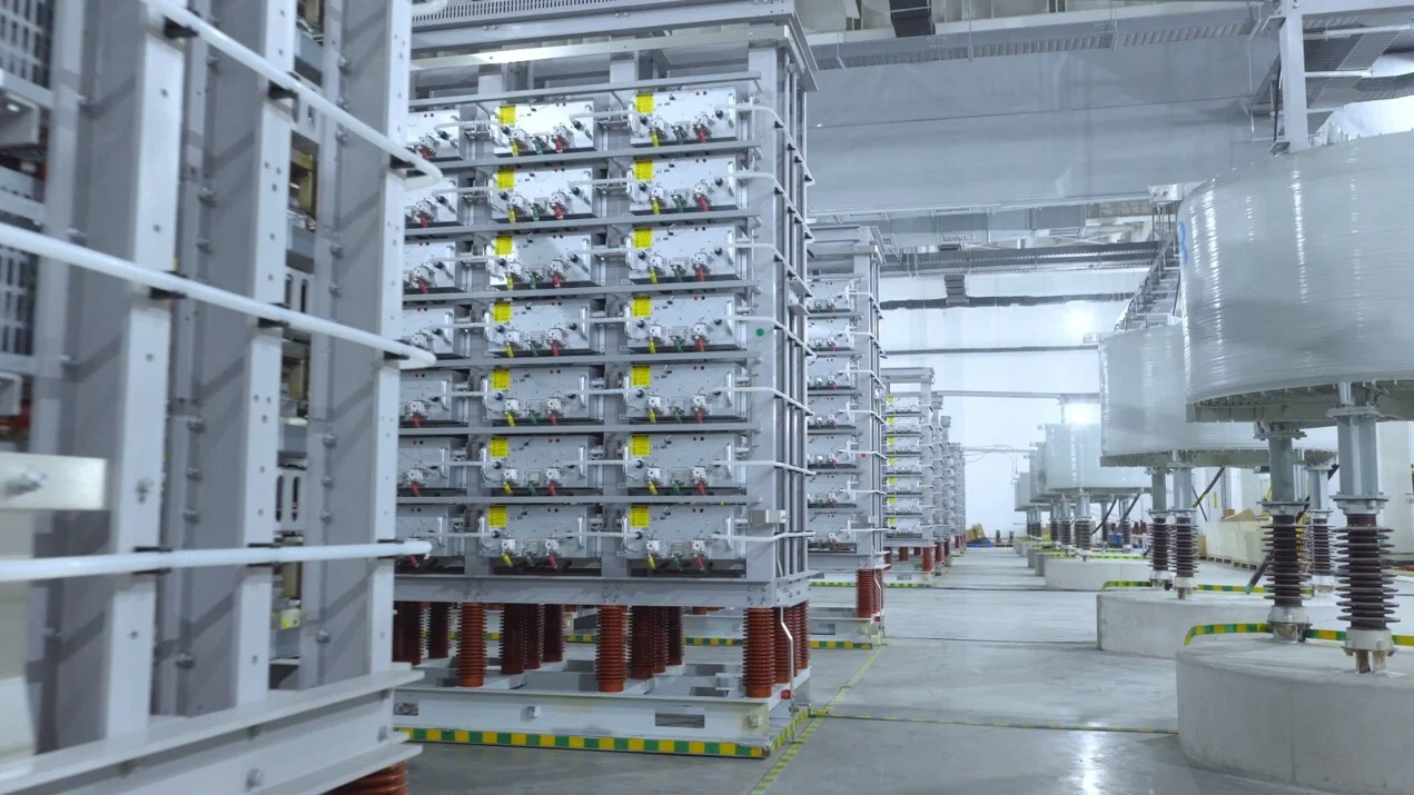 Large scale industrial energy storage testing facility with sophisticated monitoring equipment and battery racks.
