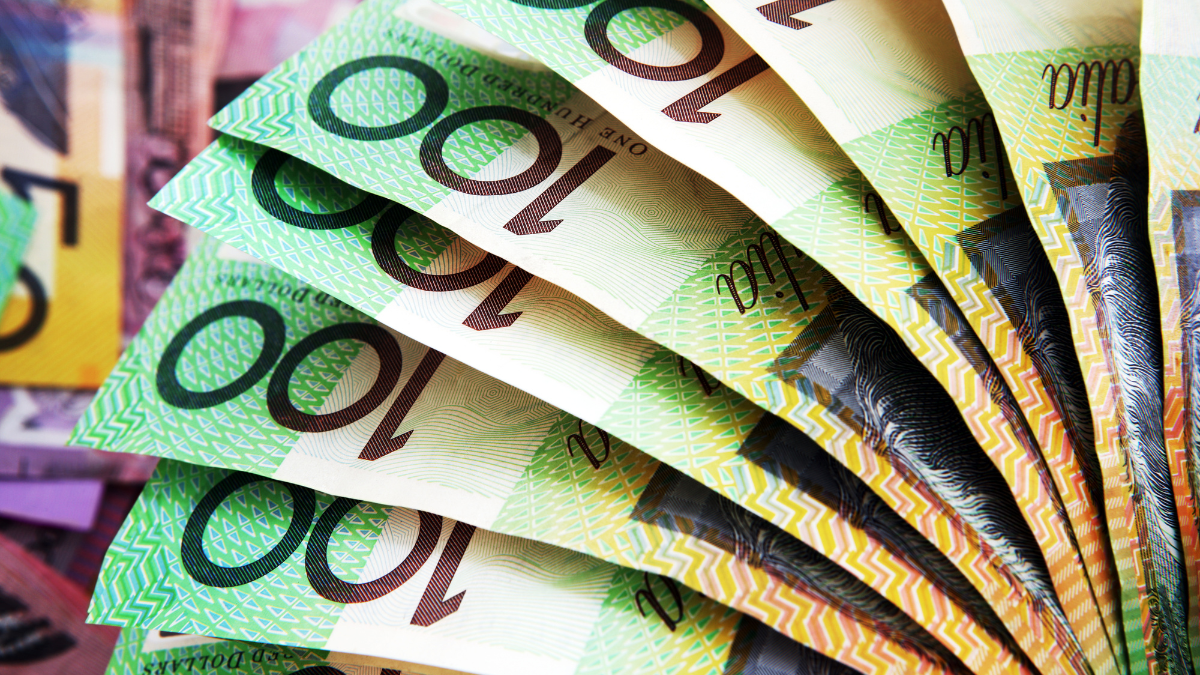 Solar panels installed on a residential rooftop under a bright blue California sky