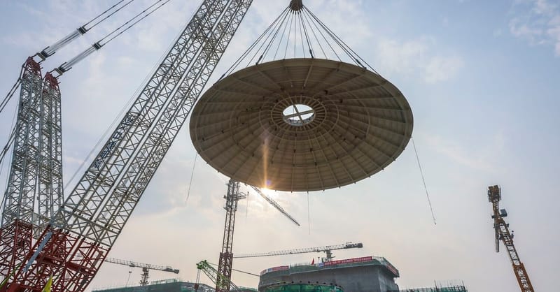 Solar panels installed on a residential rooftop with a clear blue sky background