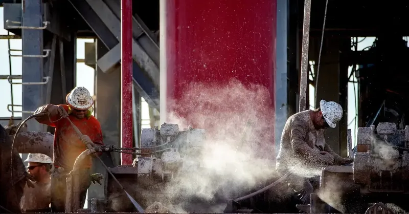 A technician inspecting a geothermal heat pump installation at a residential property in Europe.