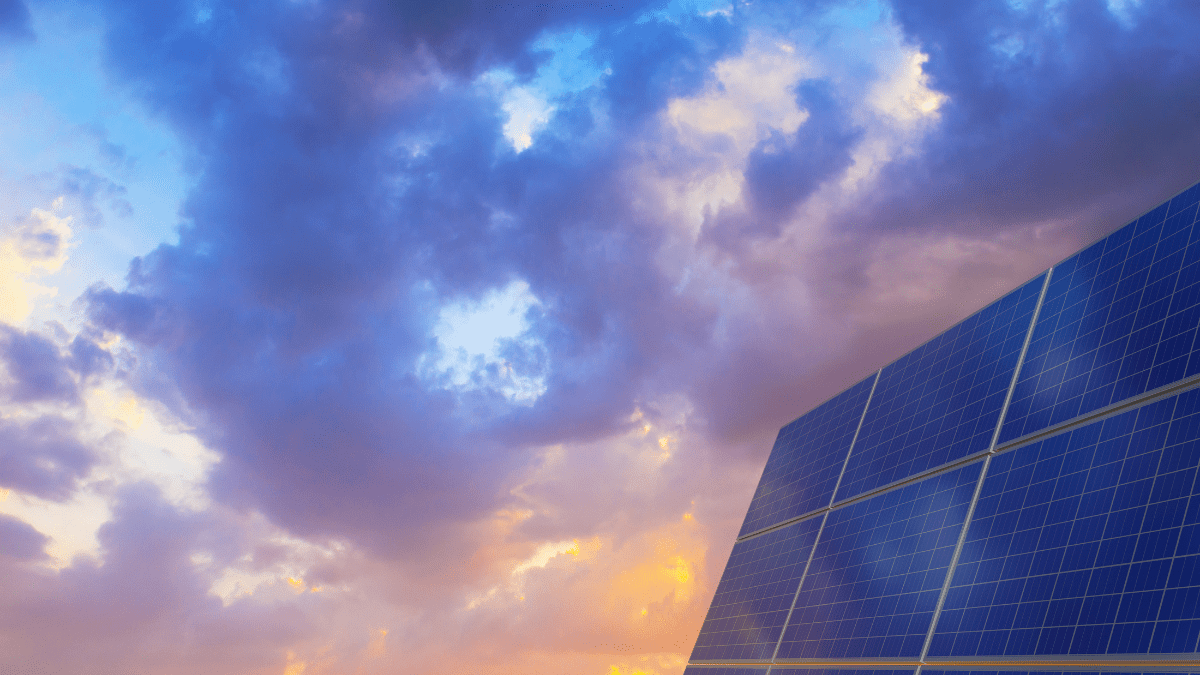 Industrial solar manufacturing facility with blue solar cells on a production line.