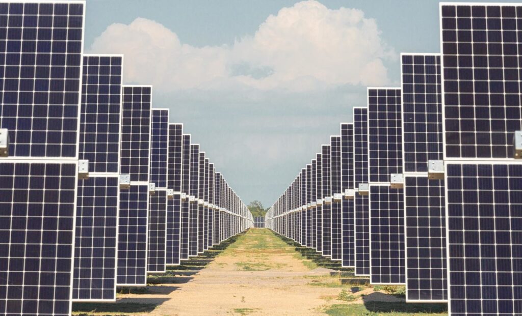 Aerial view of a large-scale Spanish solar farm with containerized battery energy storage systems