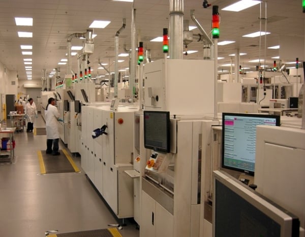 Suniva manufacturing facility signage in front of industrial solar production equipment