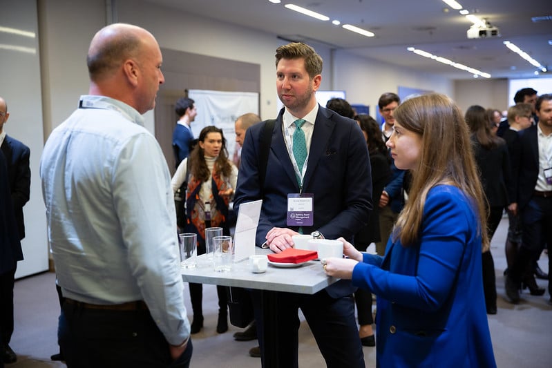 A technician monitoring a residential battery storage system using a tablet interface in Europe
