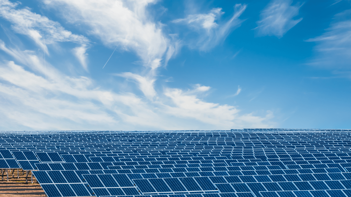 Aerial view of a massive solar farm expansion in the Khavda Renewable Energy Park, India.
