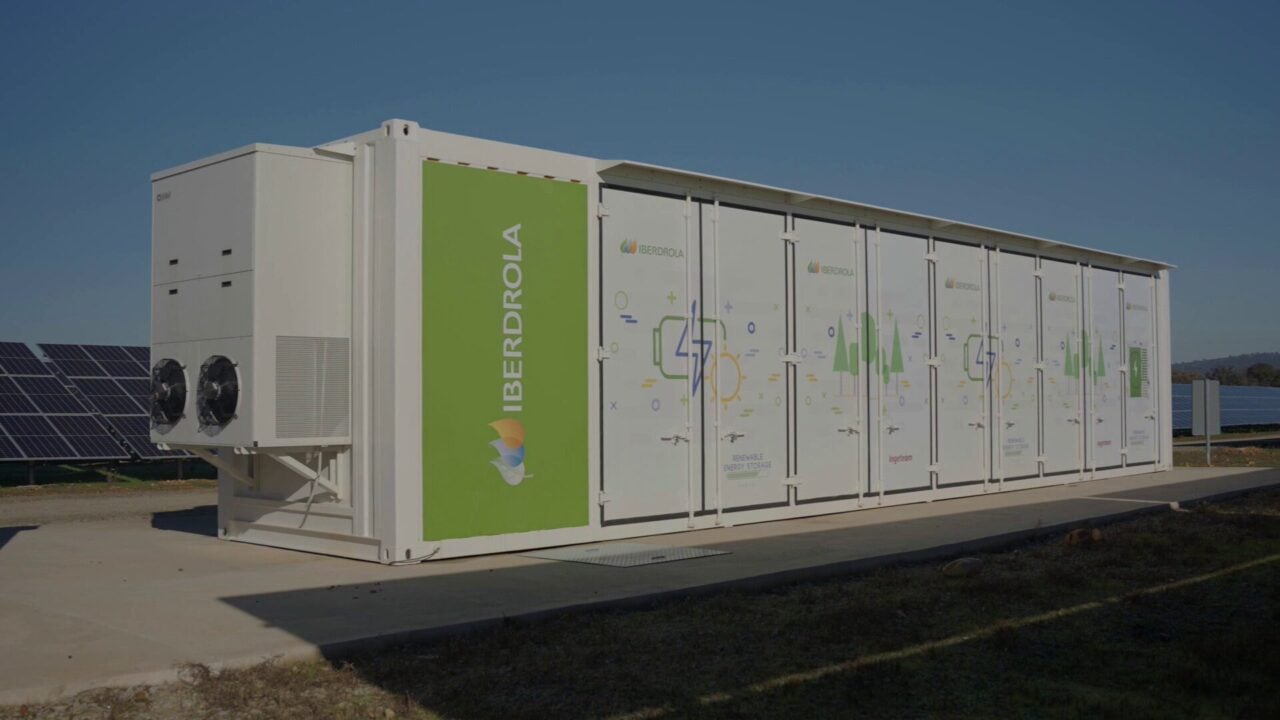 A large-scale battery energy storage system facility with rows of containerized lithium-ion batteries.