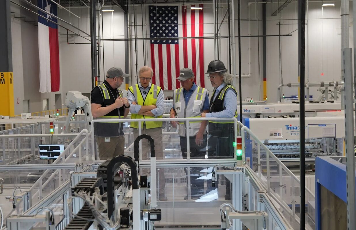 A solar panel array under a dramatic sky, illustrating resilience against extreme weather events like storms or hail.