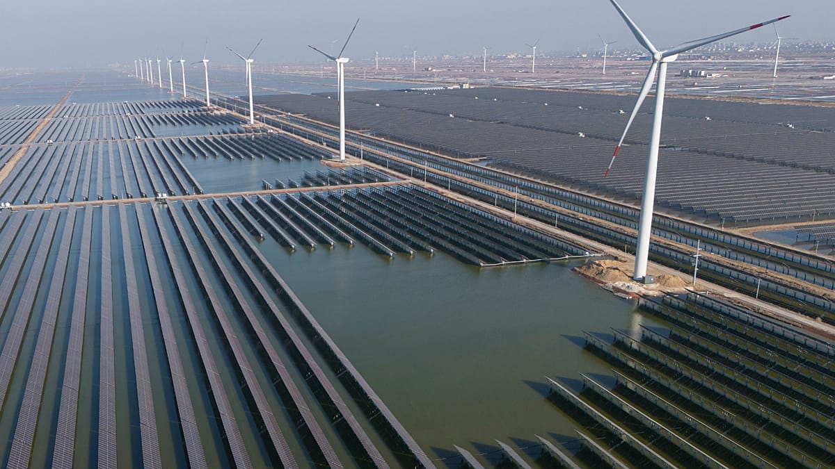 A rows of solar panels installed on a residential rooftop under a clear blue sky