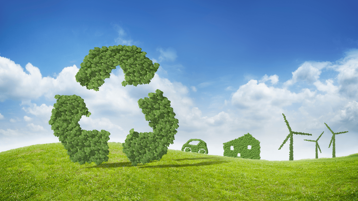 A large-scale waste-to-energy facility under a clear blue sky representing industrial clean energy.