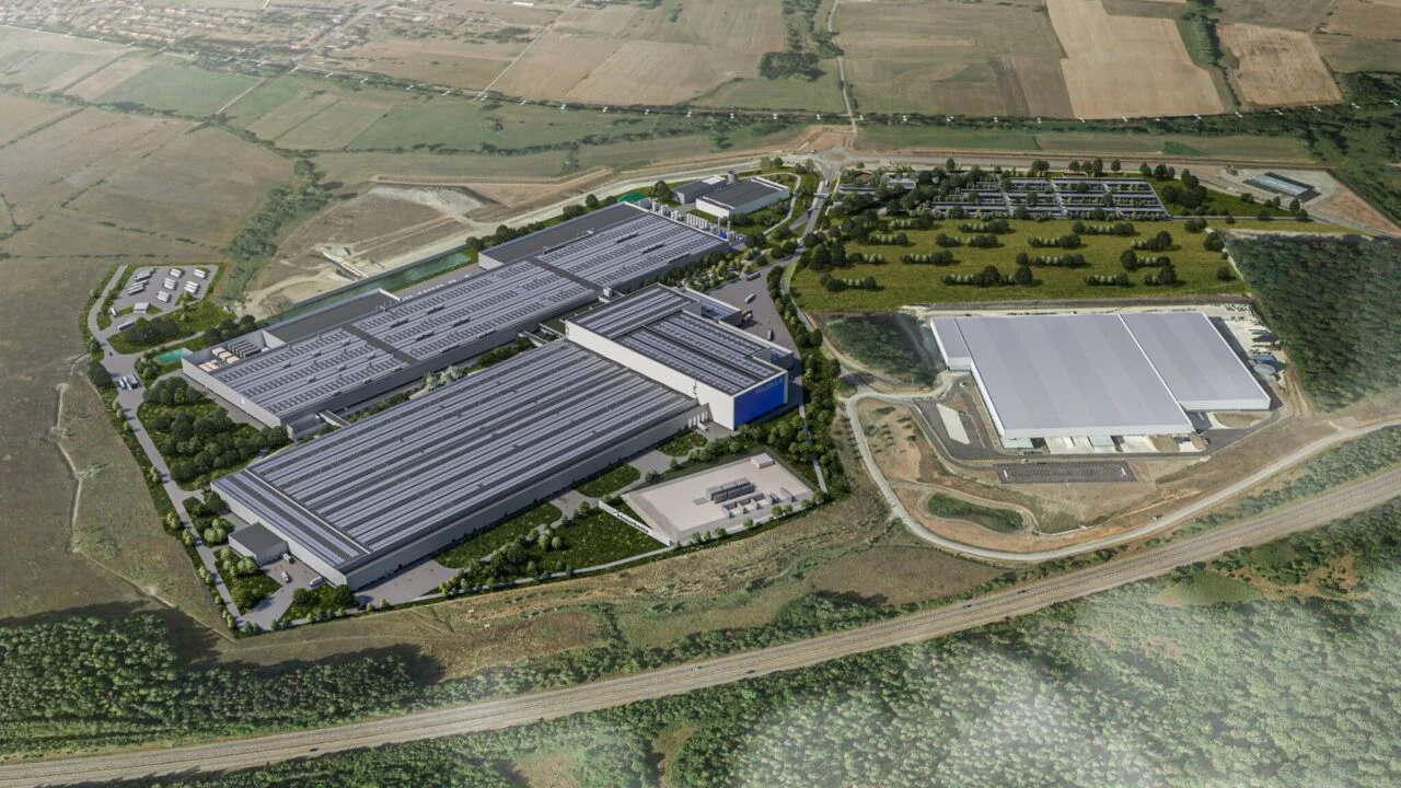 Aerial concept view of a modern solar panel manufacturing facility in France with European flags.