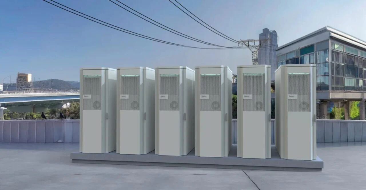 Industrial battery storage cabinets lined up in a clean, modern German facility