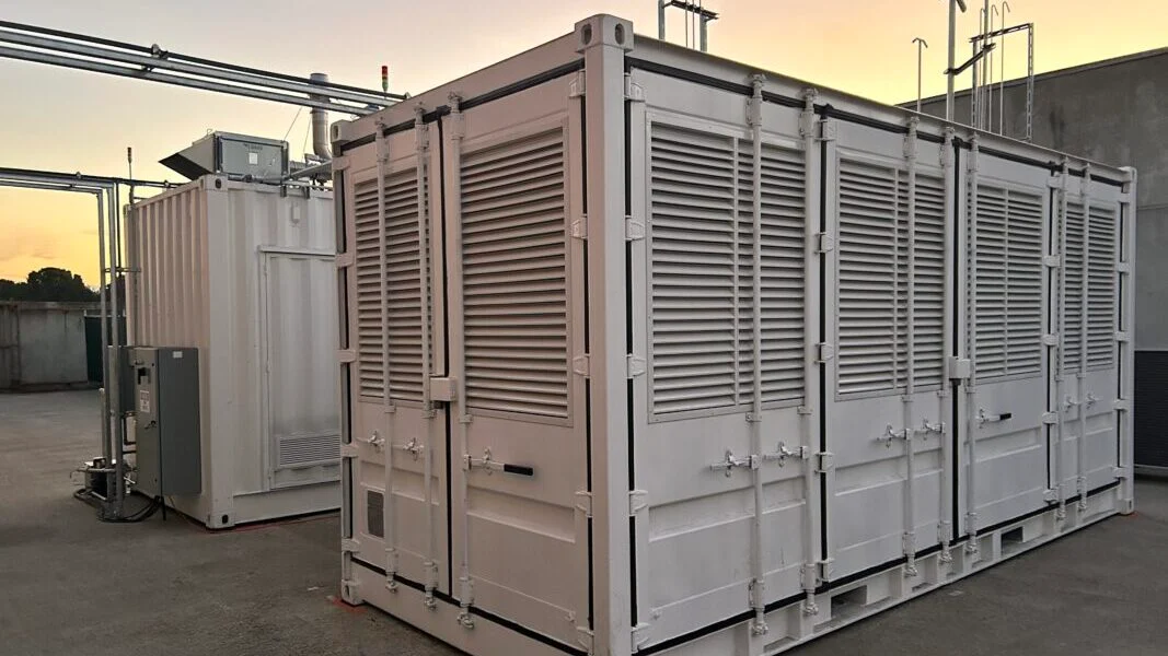 A digital rendering of large-scale energy storage containers integrated with a solar farm.