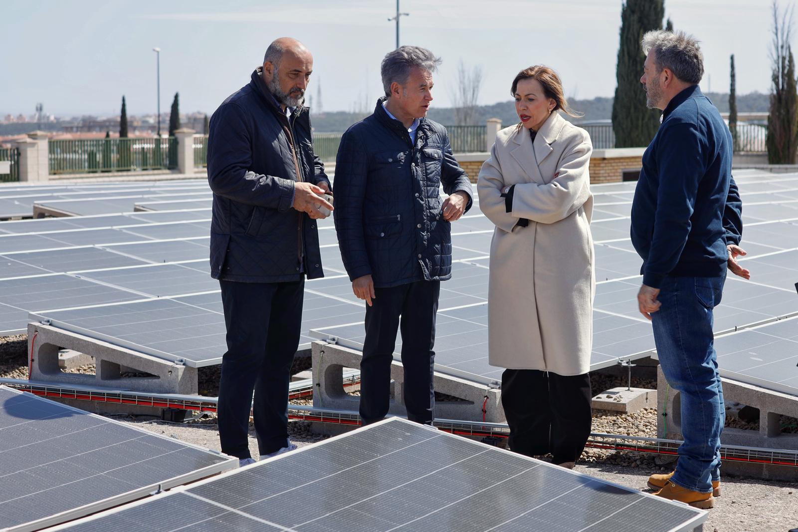 Aerial view of solar panels installed on municipal building rooftops in a Spanish city.