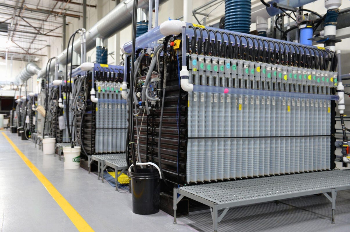 A row of iron-air battery modules installed in a large-scale energy storage site
