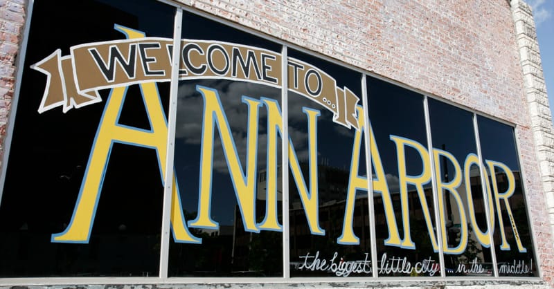 A modern solar panel installation on a municipal building rooftop under a clear blue sky.
