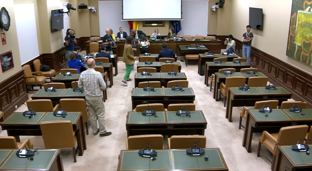 A control room technician monitoring a complex digital grid map with multiple energy nodes.