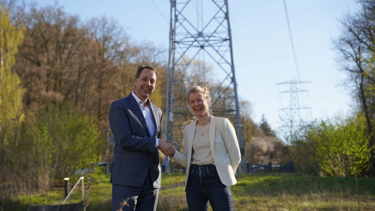 A large-scale battery energy storage system installation connected to a high-voltage electricity substation.