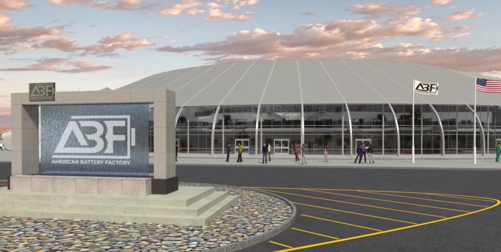 Large scale industrial battery storage facility with rows of lithium-ion battery containers in a desert landscape
