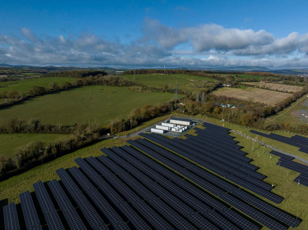 Aerial view of a European residential neighborhood with rooftop solar panels installed