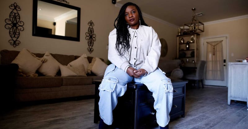 Large scale industrial ammonia plant facility showing smoke stacks and heavy infrastructure near residential housing.