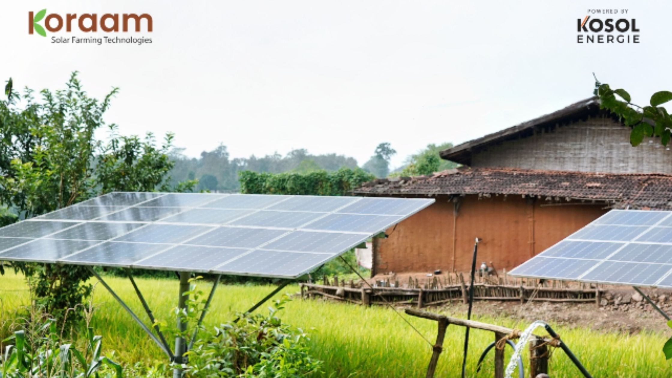 A technician inspecting a solar-powered water pumping station in a rural agricultural field.