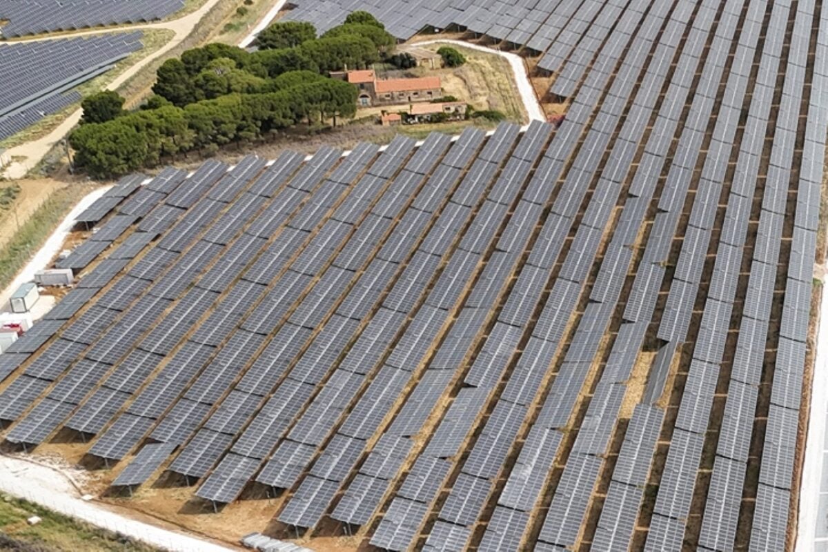Aerial view of a large-scale solar farm in the Lazio region of Italy.