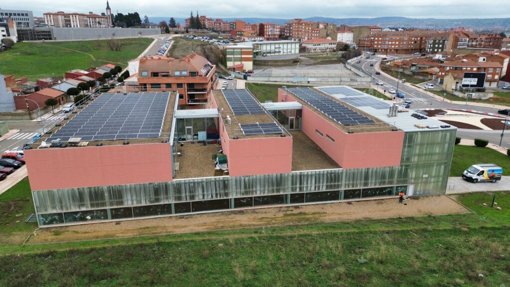 Aerial view of a Spanish municipal solar installation on rooftops for collective consumption