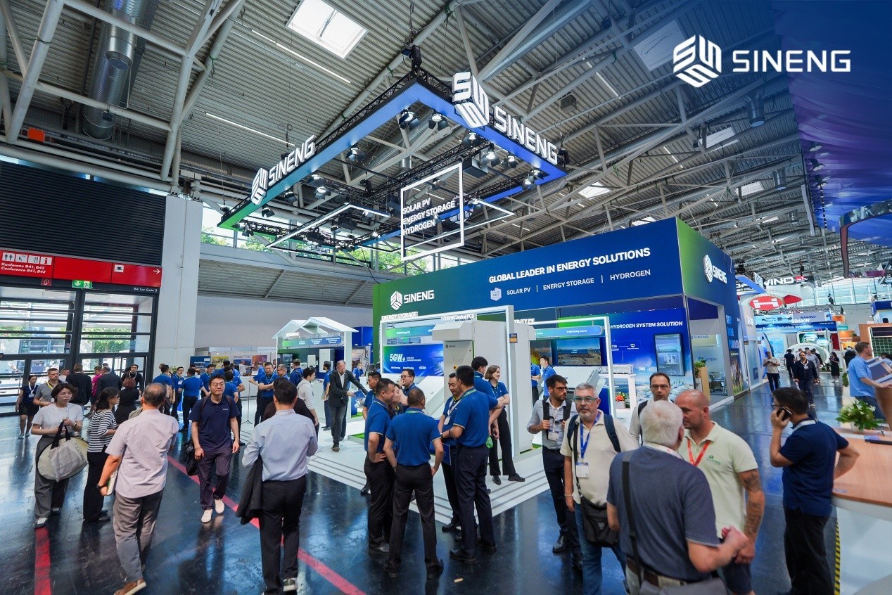 Sineng Electric booth at Intersolar Europe showcasing large-scale central inverters and battery storage containers.