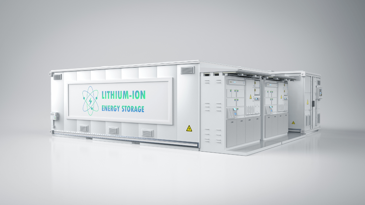 Large scale lithium-ion battery storage containers in a field under a blue sky at sunset.