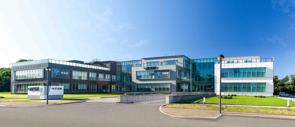 A modern solar installation in Spain with a dark cloud overhead representing market shifts.