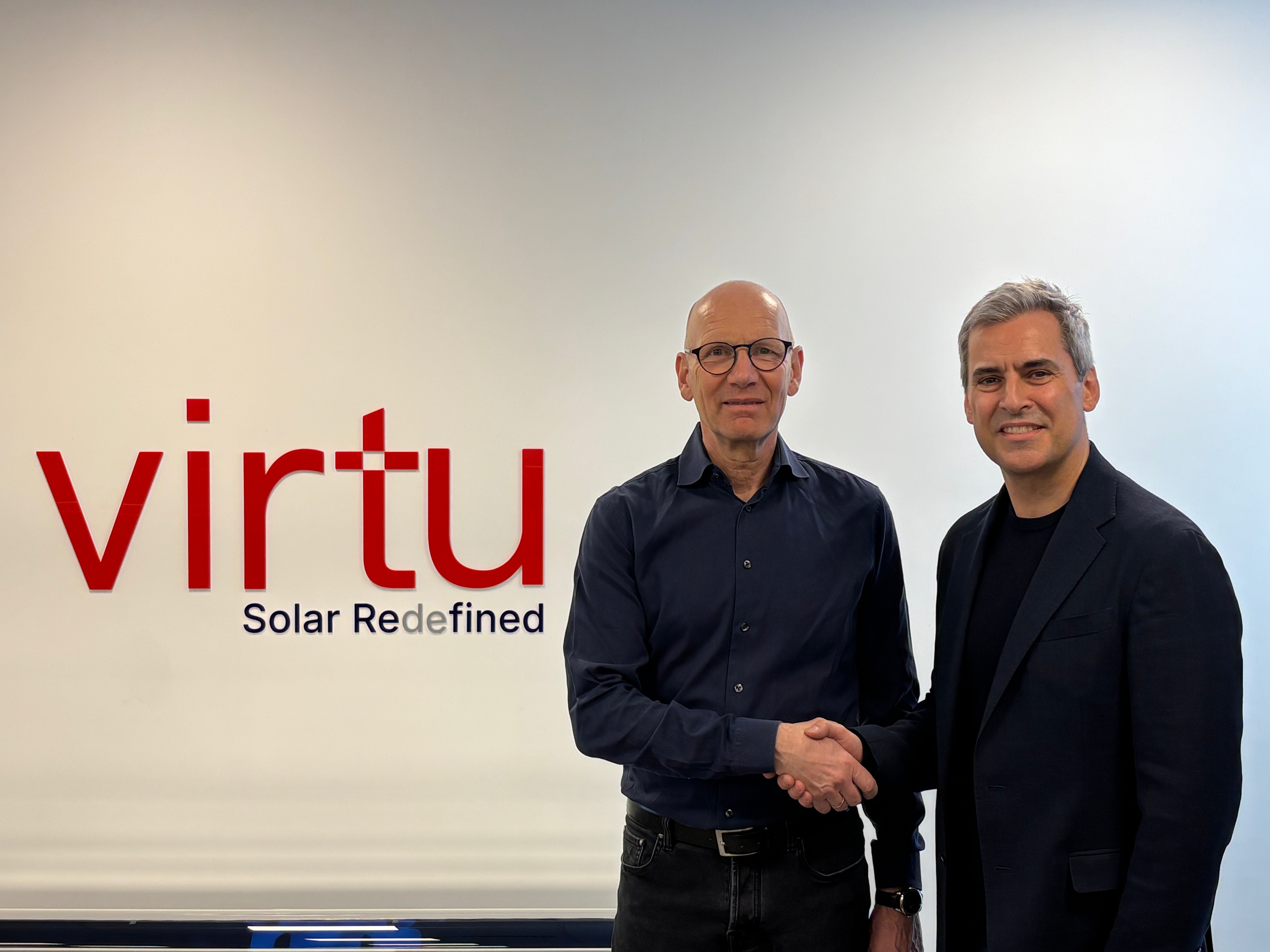 Thomas Birr and Christophe Williams posing for a professional corporate announcement photo.