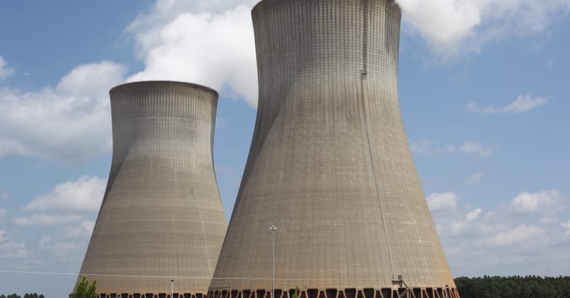 Aerial view of a large-scale solar farm integrated with battery storage units in Europe.