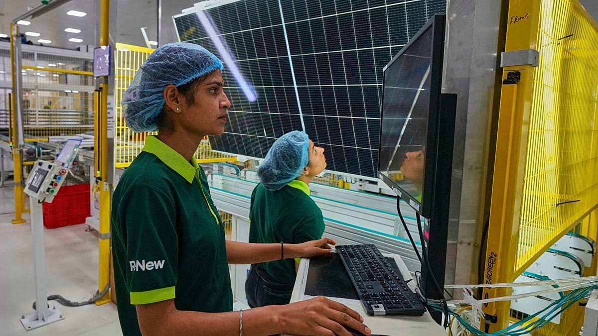 A vast solar farm landscape showing the scale of the energy transition