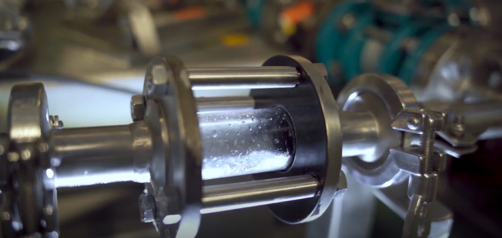 A professional solar energy analyst reviewing charts and data on a digital tablet screen.