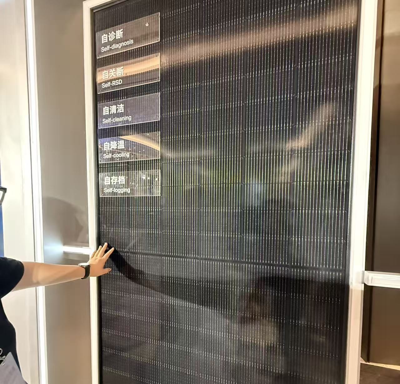 Close-up of a high-tech solar module with integrated power electronics and AI branding elements.