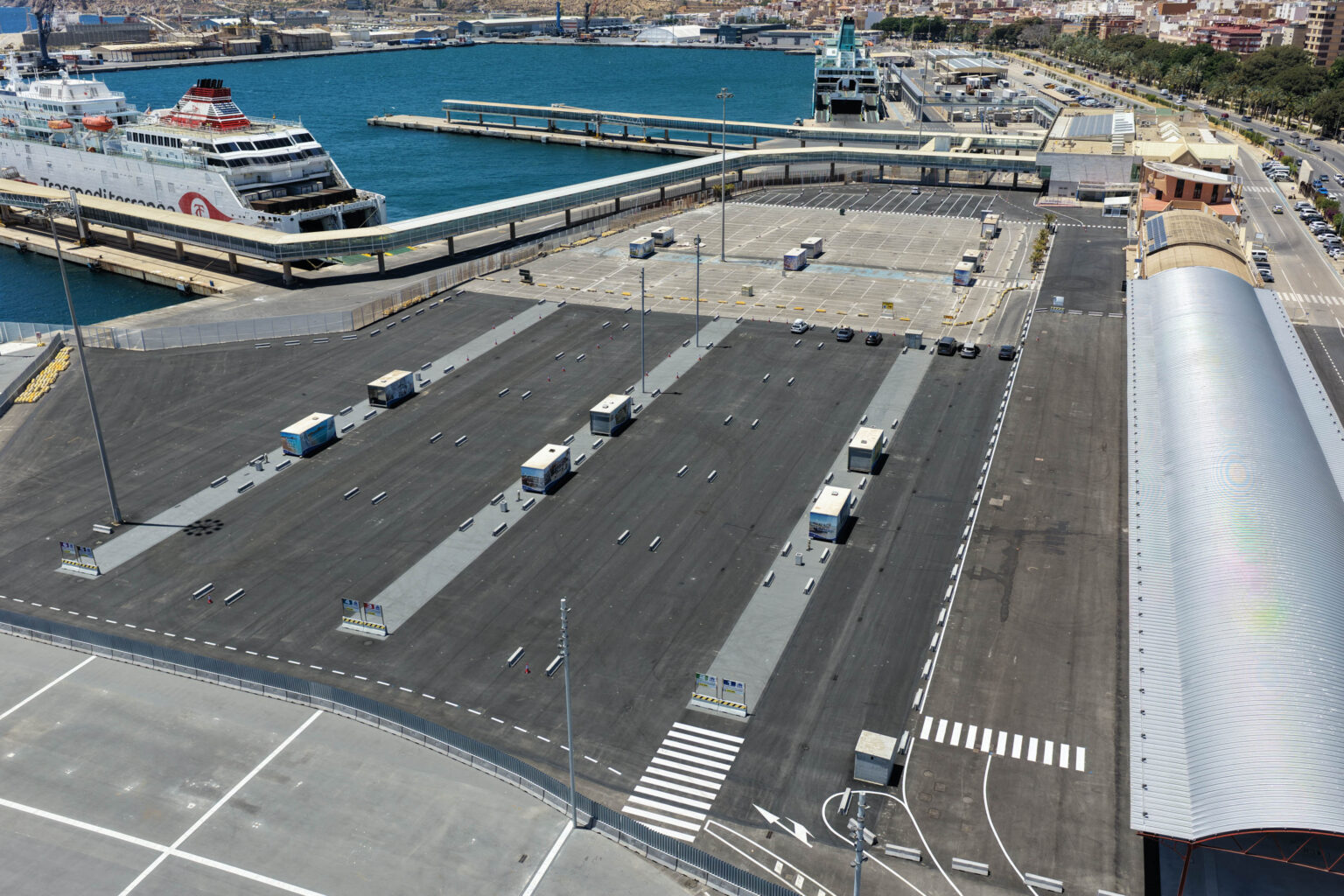 Large scale solar carport structure under construction at a commercial port facility