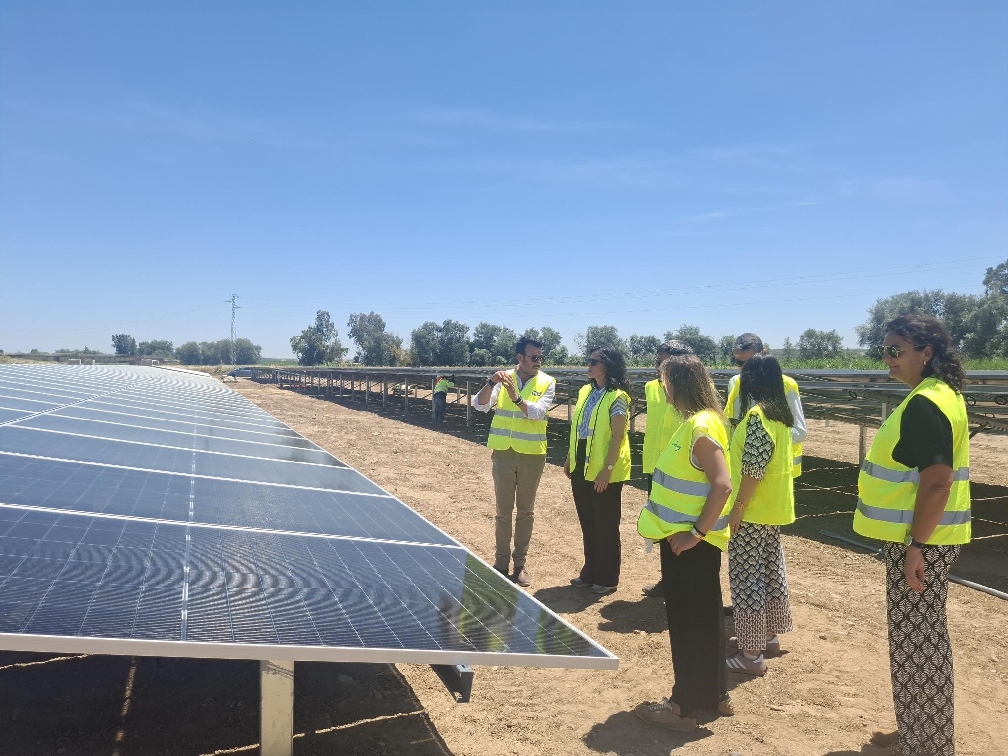 Large-scale solar PV array in a Spanish agricultural field powering a water pumping station.